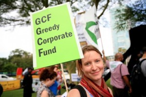 Protester denouncing the role of the private sector in the future Green Climate Fund.