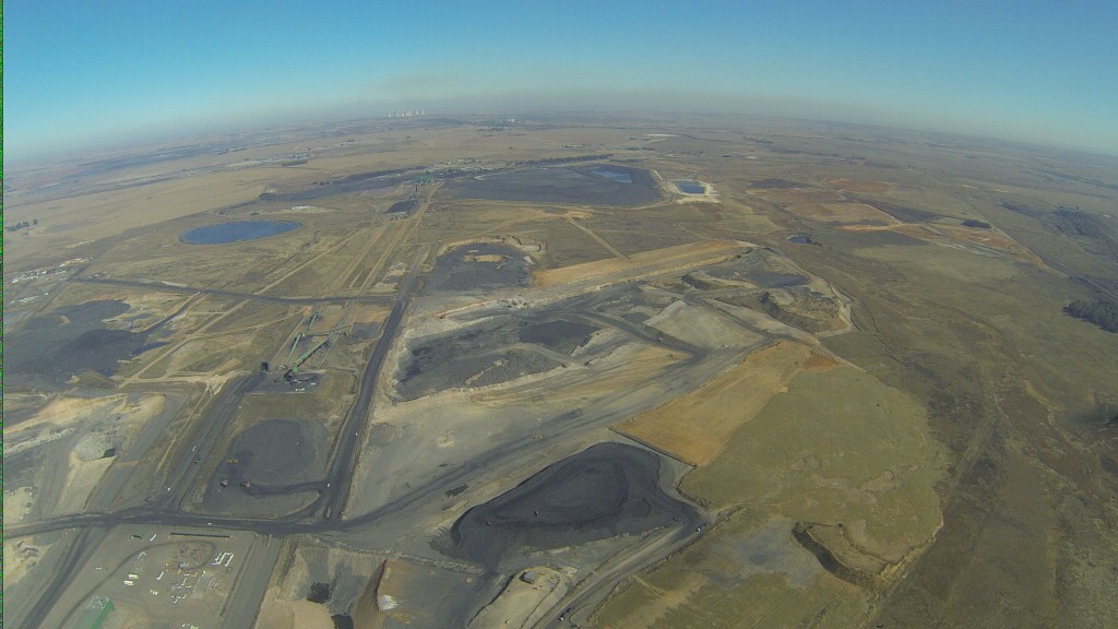 Energy production through opencast coal mining and coal-fired power stations has transformed the landscape on the Mpumalanga Highveld, and filled the atmosphere with smog. Each power station emits a toxic combination of SO2, NOx, particulate matter, and other pollutants. Photo: Melissa Fourie/CER 